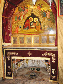 The altar at the grotto of the Nativity in Bethlehem. The star under the altar is at the place of Jesus' birth.