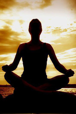 silhouette of a yogi at sunrise